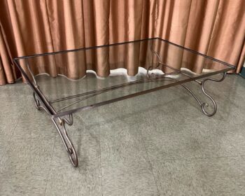 large iron coffee table with glass top
